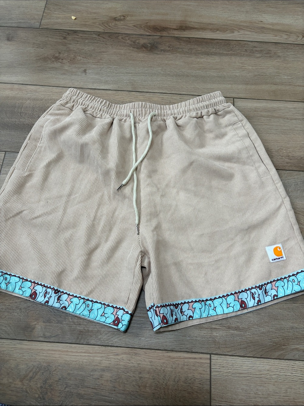 Carhartt Tan Corduroy Drawstring Shorts with Blue Patterned Hem